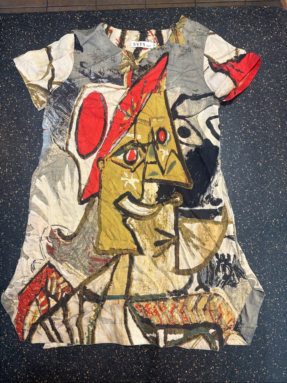 SYFS dress features an abstract, Picasso-inspired face print